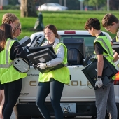 Volunteers clear a truck of electronic equipment at the Columbus Engine Plant’s Community Recycling Day.